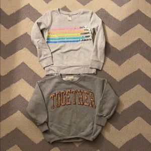 Pair of sparkly sweatshirts